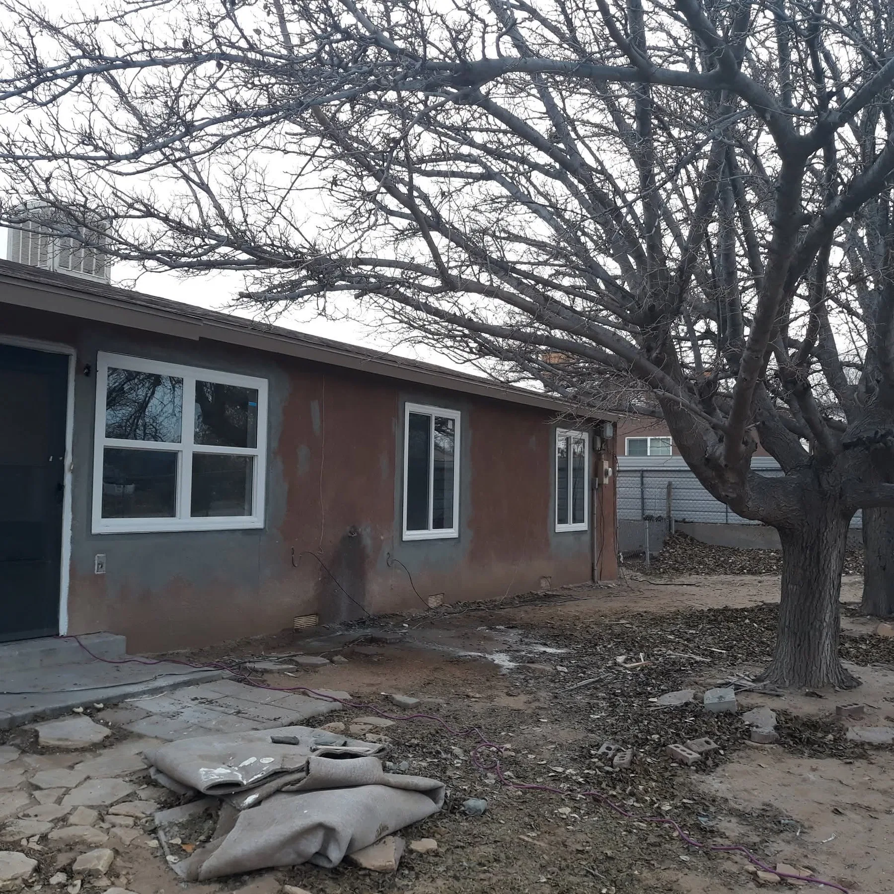 Repaired and repainted stucco exterior on an Albuquerque home