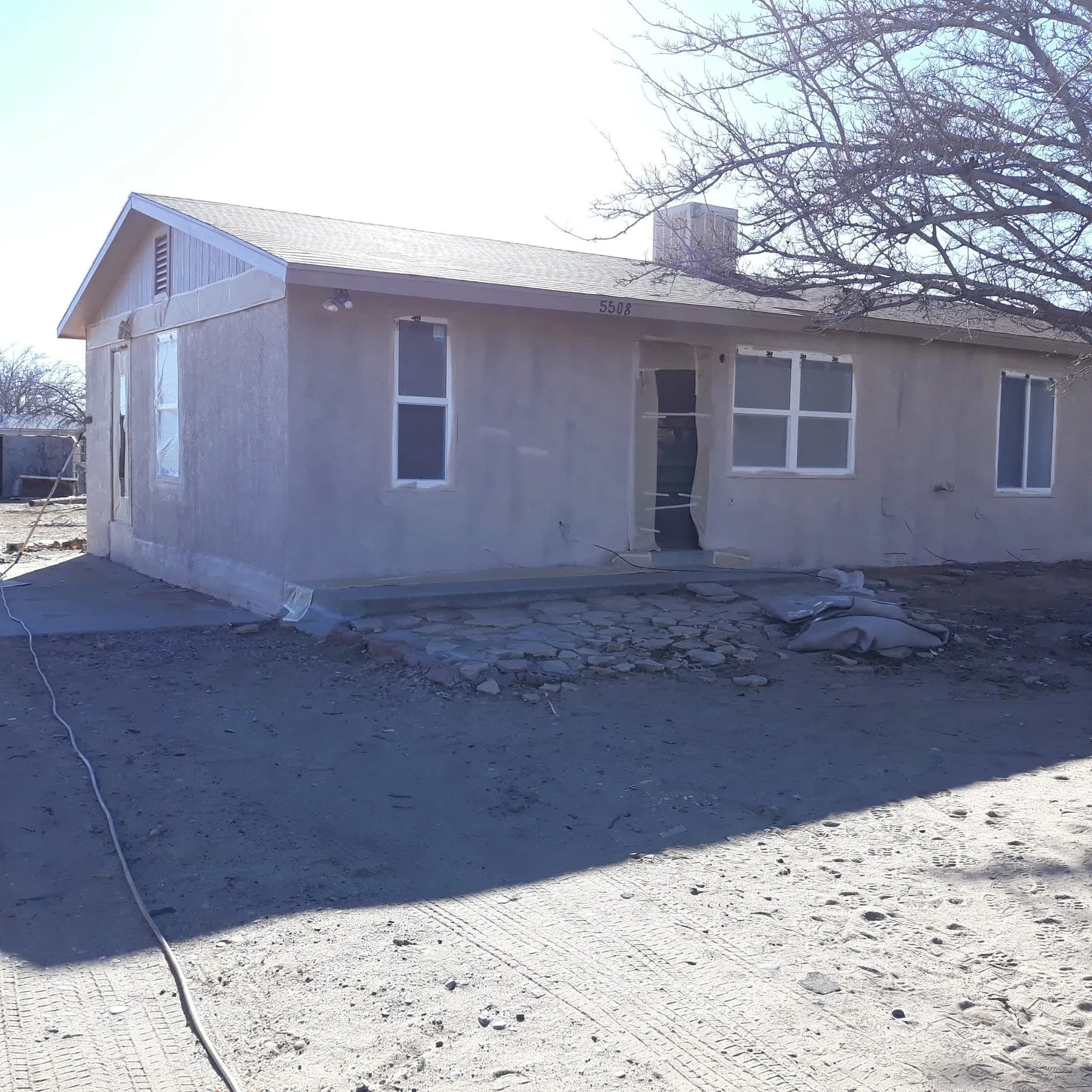 Exterior stucco patch and repaint
