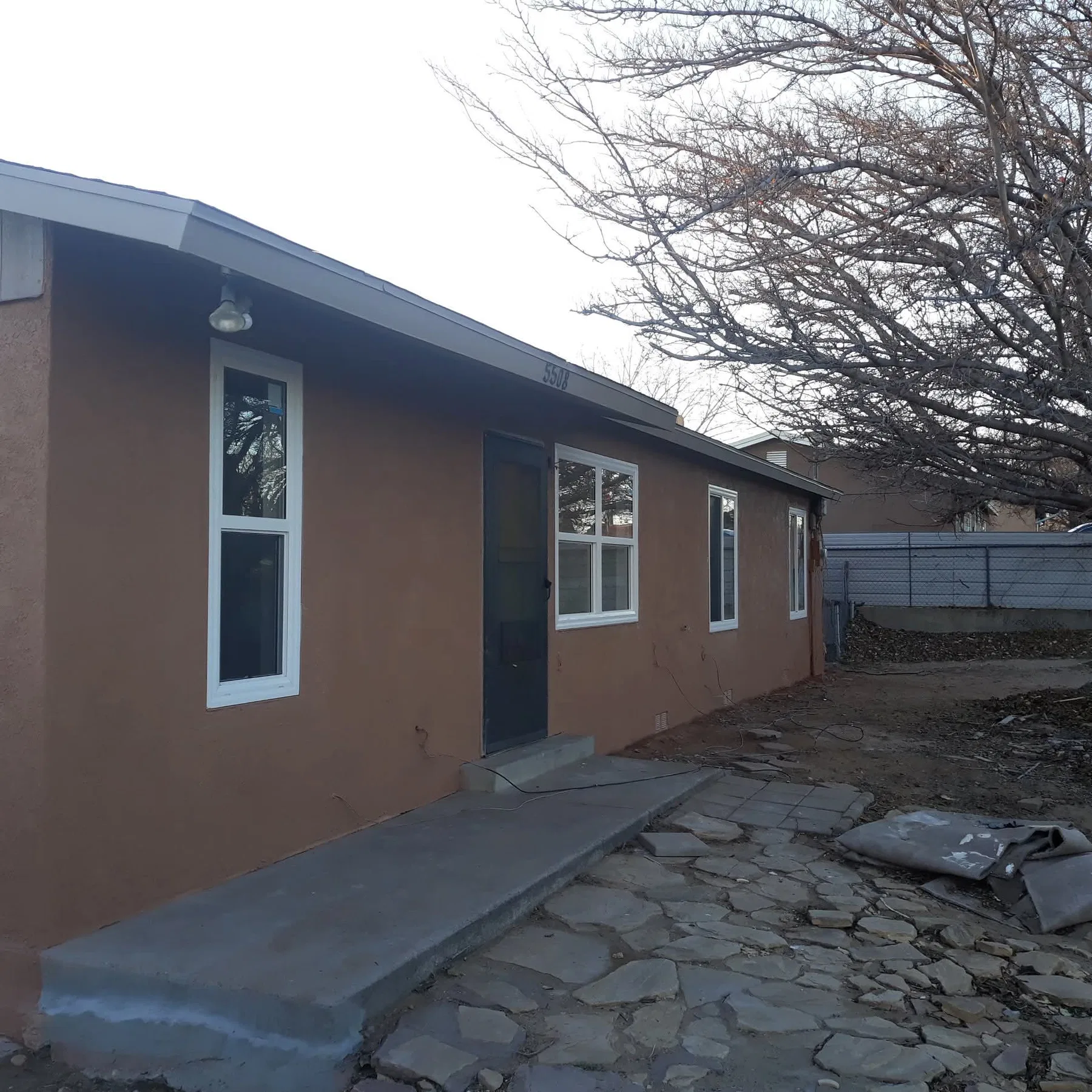 Repaired and repainted stucco exterior on an Albuquerque home