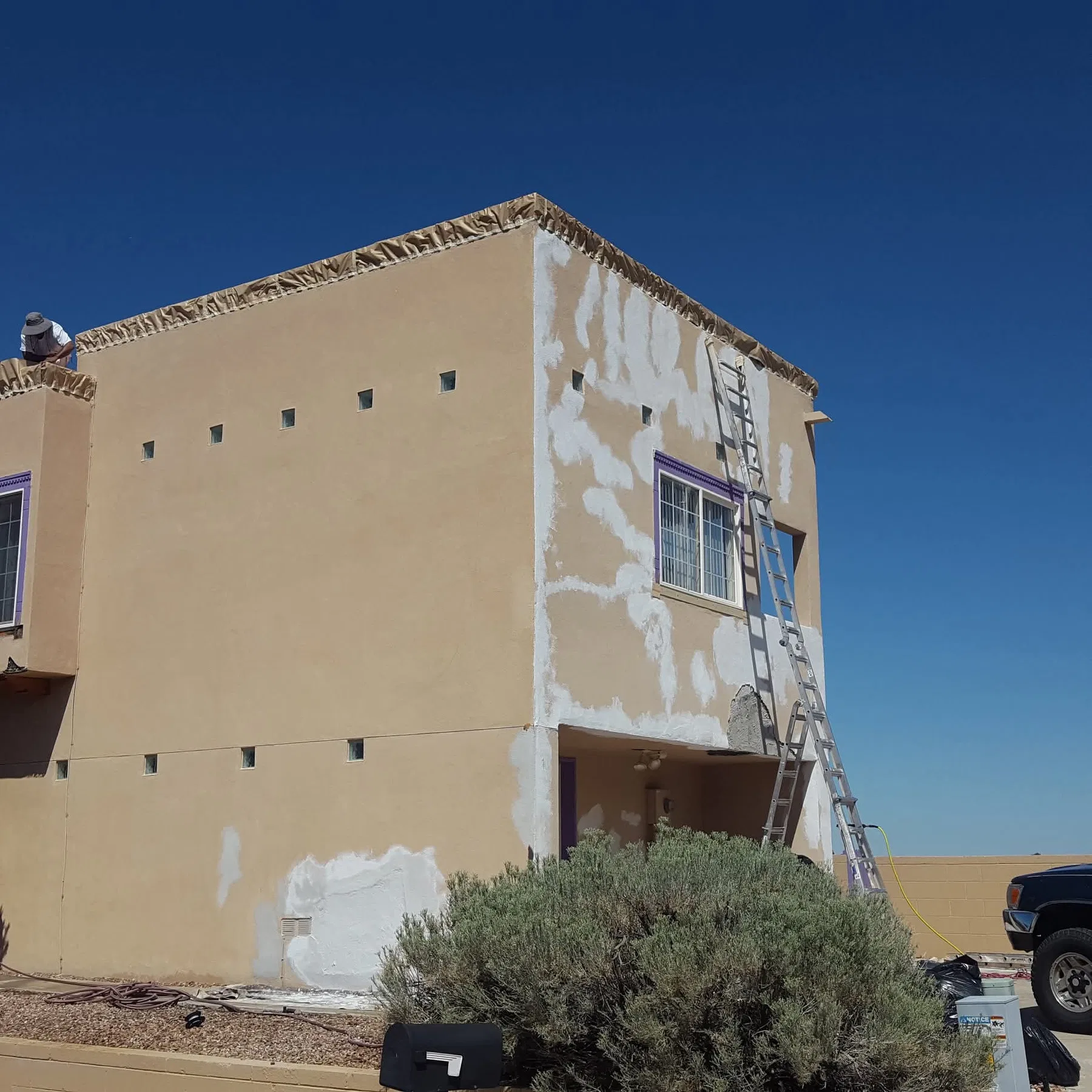 Repaired and repainted stucco exterior on an Albuquerque home
